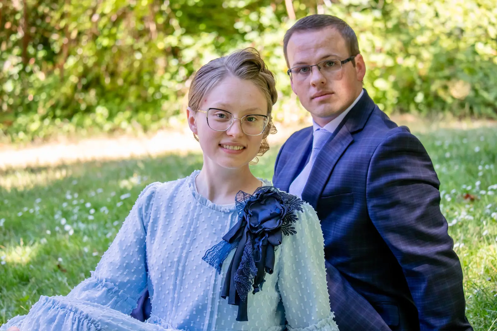 Alyssa and Caleb together in a sunlit garden